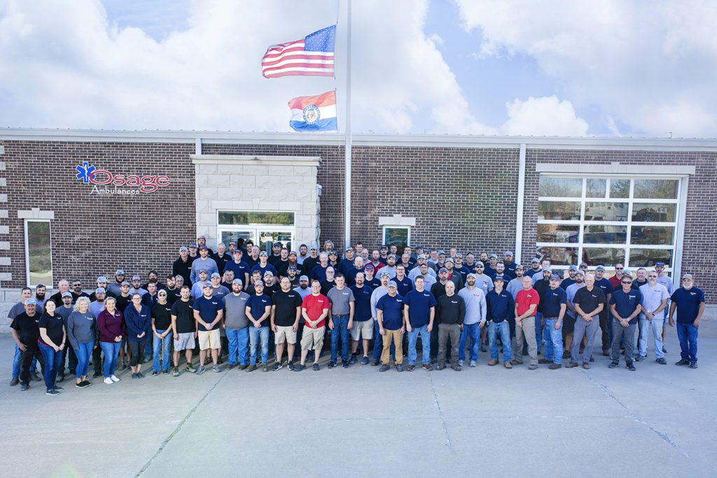 osage ambulance staff standing in front of their headquarters